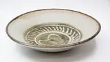 Doreen Blumhardt, Early large stoneware bowl, decorated with an abstract green-grey wax resist pattern on an oatmeal ground