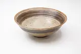 Margaret Milne, Stoneware bowl, decorated with a band of saturated iron glaze around the rim on a grey ash glaze