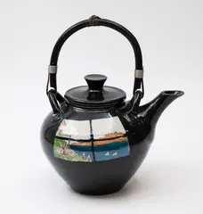 Peter Lange, Porcelain teapot, painted to both sides with a window looking at a seaside landscape on a black background, with cane handle