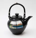 Peter Lange, Porcelain teapot, painted to both sides with a window looking at a seaside landscape on a black background, with cane handle