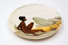 Martin Boyd Pottery, Small slip-cast dish, hand painted with an Aboriginal boy holding a boomerang, with metal hanging fittings