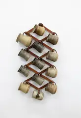 Jack Laird, A collection of twelve stoneware mugs, together with a small jug (AF), with hanging wooden stand