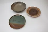 New Zealand Studio Pottery, Three ceramic circular platters, the first by Mary Hardwick-Smith, the second by Carl Vendelbosch, and the third by Michael Whitmore