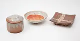 New Zealand Studio Pottery, Selection of three small shino glazed ceramics, comprising two Warwick Lidgard small dishes and a small Campbell Hegan lidded jar