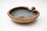 Len Castle, Pacific Series bowl, with stylised avian finial, the interior with mottled green-grey and white glazes, the textured exterior with umber pigment