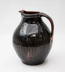 Greg Barron, Large stoneware jug, with tenmoku glaze, the body decorated with vertical ribs