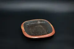 Square stoneware platter by Potter Unknown, heavily potted, with dark grey glaze to the centre, unglazed rim and exterior; possibly by Doreen Blumhardt, sold Feb 2024