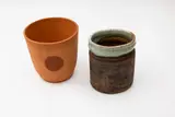 Terracotta vase by Phoenix Pottery (Michael Lucas & Jill Totty), printed potters' marks to the base; together with an unmarked stoneware jar, offered Feb 2024
