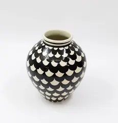 Hand potted vase by Frank Carpay for Crown Lynn, decorated with repeat scalloped scale pattern in black on a white ground (minor hairline crack), sold Feb 2024