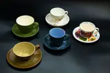 A collection of five cups and saucers by Crown Lynn Potteries, each in a different pattern, comprising 'Fleurette', 'Dorothy Thorpe Pine', 'Dorothy Thorpe Palm Spring', 'Autumn Splend, offered Feb 2024