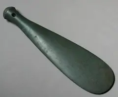 Patu Onewa, A large 19th century stone nephrite patu, of traditional form with spatulate tapered end, the butt end with three concentric ridges and partially drilled hourglass suspension hole.