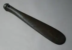 Patu Onewa, 19th century stone club, of traditional form with spatulated tapered blade, the butt end with four concentric ridges and one in the centre, hourglass suspension hole.