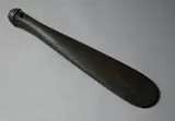 Patu Onewa, 19th century stone club, of traditional form with spatulated tapered blade, the butt end with four concentric ridges and one in the centre, hourglass suspension hole.