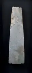 Toki - Adze, Large rare greywacke stone toki, quadrangular form, straight vertical sides, with unusual small notches along the length of the four edges of the adze up to the poll, flakes to poll. Slightly curved sharp rounded blade.