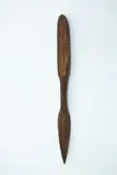 Ketu, Wooden digging implement, dark brown wood, oval handle, with single suspension hole, short rounded shaft and paddle shaped blade