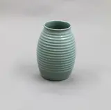 Rare ‘Heron grey’ small ovoid vase by Keith Murray for Wedgwood, the body finely ribbed, shape no. 3870, offered Oct 2023