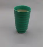 Keith Murray for Wedgwood, Matt green ribbed vase, with flared sides, raised on a foot, shape no. 4314