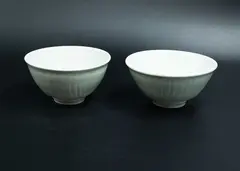 Campbell Hegan, Two bowls, pale blue ceramics with wavy ridges on their body