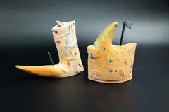 Steve Fullmer, Boot & Boat, hand-modelled earthenware of stylised boot and boat shapes with sgraffito decoration and splashes of blue and red