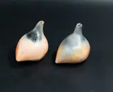 Jo Munro, Duo of Birds, ceramics, in a gradation of oranges and blacks