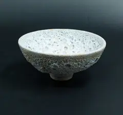 Lava bowl by John Parker, light cornflower blue glazed ceramic with textured volcanic crater motifs, sold Oct 2023