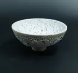 John Parker, Lava bowl, light cornflower blue glazed ceramic with textured volcanic crater motifs