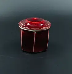 Campbell Hegan, Lidded jar, stoneware, heptagonal body and domed lid, with rich sang de boeuf glaze, ribbed interior
