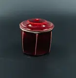 Campbell Hegan, Lidded jar, stoneware, heptagonal body and domed lid, with rich sang de boeuf glaze, ribbed interior