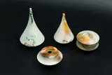 Cecilia Parkinson, Selection of ceramics, comprising two bud vases, one lidded box and one squat bud vase, cloudy grey matte glaze with orange accents, the box's interior with dark indigo mottled and iridescent glaze