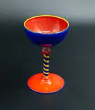 Giovanni Glass, Goblet, blown glass in orange, blue, and yellow with an opaque effect, stripy stem with floral finial