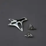 Henning Koppel for Georg Jensen, Sterling silver brooch and earrings, heavy sterling silver and black enamel brooch no. 323 and sterling silver clip-back 'amoeba' earrings no. 119