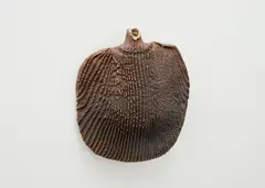 Hanging bottle by Len Castle, stoneware with textured ribbing pattern and bead motifs around the neck, sold Oct 2023
