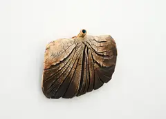 Hanging bottle by Len Castle, iron oxide-washed stoneware with textured finish and blue glaze inside the neck, sold Oct 2023