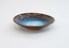 Small bowl by Len Castle, stoneware with jun glaze, mottled effect, in a gradation of blues and browns, sold Oct 2023