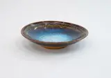 Small bowl by Len Castle, stoneware with jun glaze, mottled effect, in a gradation of blues and browns, sold Oct 2023