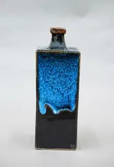 Square bottle vase by Len Castle, stoneware slab vase with jun glaze over tenmoku, sold Oct 2023