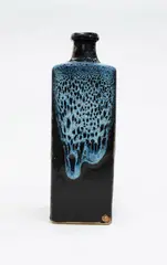 Square bottle vase by Len Castle, stoneware with jun glaze poured over tenmoku, sold Oct 2023