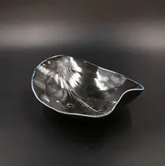 Chris Weaver, Porcelain salt fired shaped bowl, in dark blue, decorated with stylized leaf design