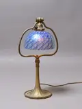 Desk lamp by Tiffany Studios, gilded bronze with damascene shade, sold Sep 2023