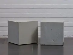 A pair of Softcrete coffee tables by Ross Lovegrove, polyurethane foam, sold Sep 2023