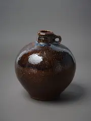Stoneware Flask by Peter Alger, bulbous form with single handle, sold May 2023