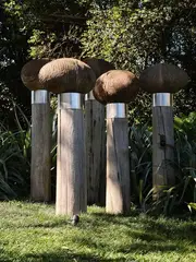 Christine Boswijk, Five Garden Keepers, ceramic coiled oval forms on found wharf piles (2012)