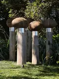 Christine Boswijk, Five Garden Keepers, ceramic coiled oval forms on found wharf piles (2012)