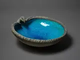 Sea Hawk bowl by Len Castle, with rich alkaline blue glazed interior and volcanic type, silica-rubbed exterior, sold Mar 2023