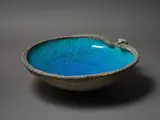A large Sea Hawk bowl by Len Castle, with rich alkaline blue glazed interior and volcanic type, silica-rubbed exterior, sold Mar 2023