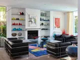 A genuine LC3 sofa manufactured by Cassina by Pierre Jeanneret and Charlotte Perriand Le Corbusier, iconic design with frame in tubular steel and separated upholstery in black leather, sold Mar 2023