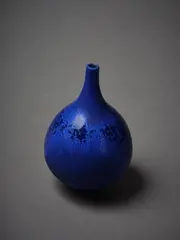 Spire necked vase by John Parker, with matte blue glaze, sold Mar 2023