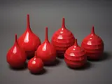 John Parker, Seven spire neck vases, with red glaze and graduating concentric pattern (two a/f)