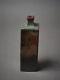 Len Castle, A square sided bottle vase, in tenmoku glaze with wax resist decoration