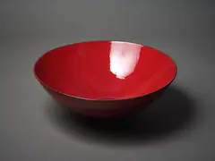 Large hemispherical bowl by Len Castle, with red speckled lava glaze, sold Mar 2023